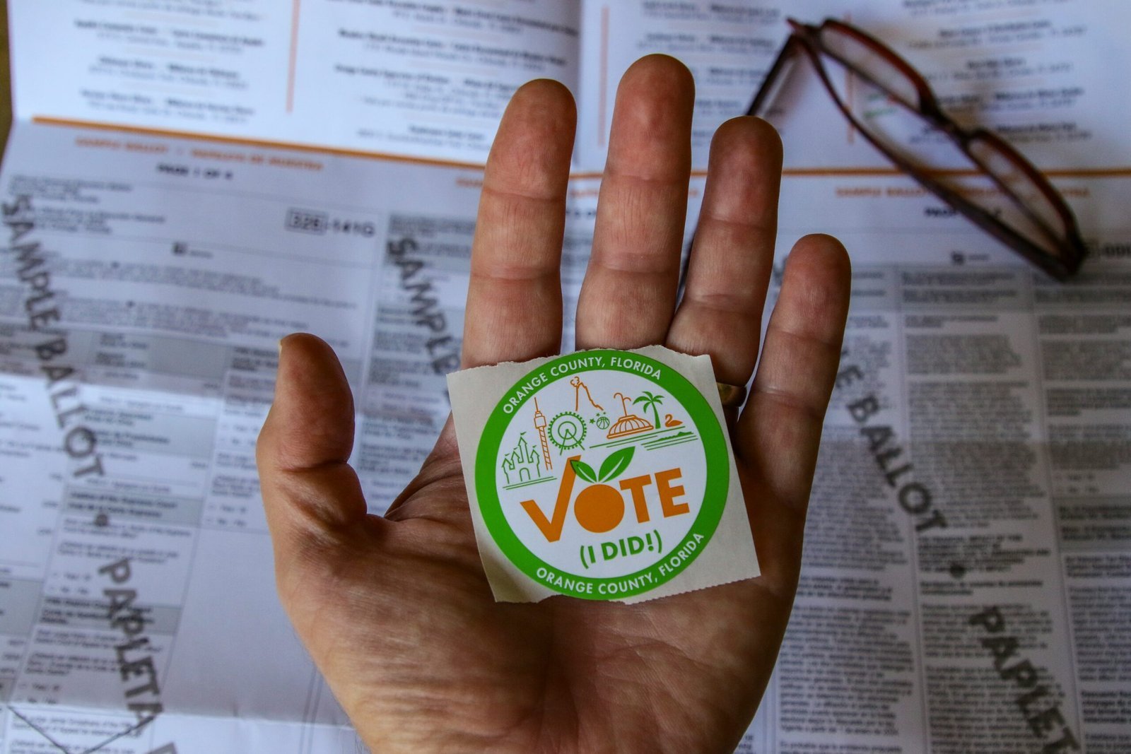 person-holding-green-and-white-round-plastic-container-scaled-1 Understanding the Election Commission of India: Its Role, Functions, and Importance